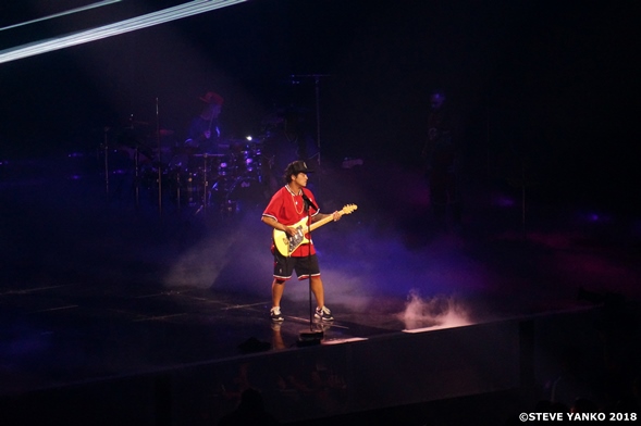 Bruno Mars playing guitar in the song 'Calling All My Lovelies'.